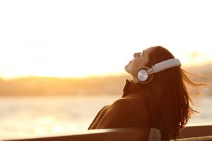 Woman,Wearing,Headphones,Listening,To,Music,Breathing,Fresh,Air,Relaxing